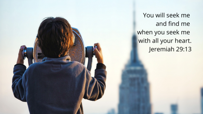 Boy looking through telescope at the Empire State Building with quotation of Jeremiah 29:11-13, NIV